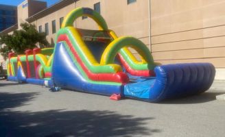 inflatable deluxe obstacle course jumper with slide